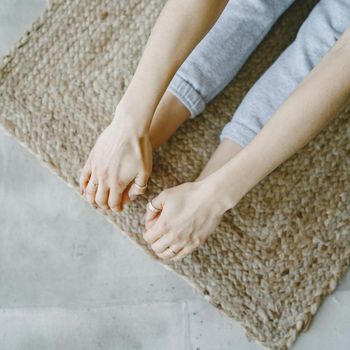Close-up of a person's feet on a yoga mat.
